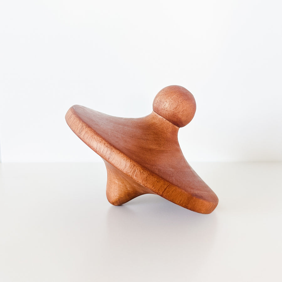 Natural wooden spinning top toy.  Hand turned from sustainably sourced wood and sealed with beeswax.