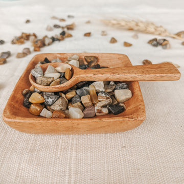  This stunning miniature wooden dish and scoop are handcrafted from neem wood.