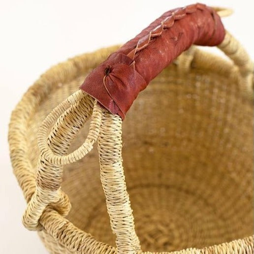 Woven basket with leather handle home decor