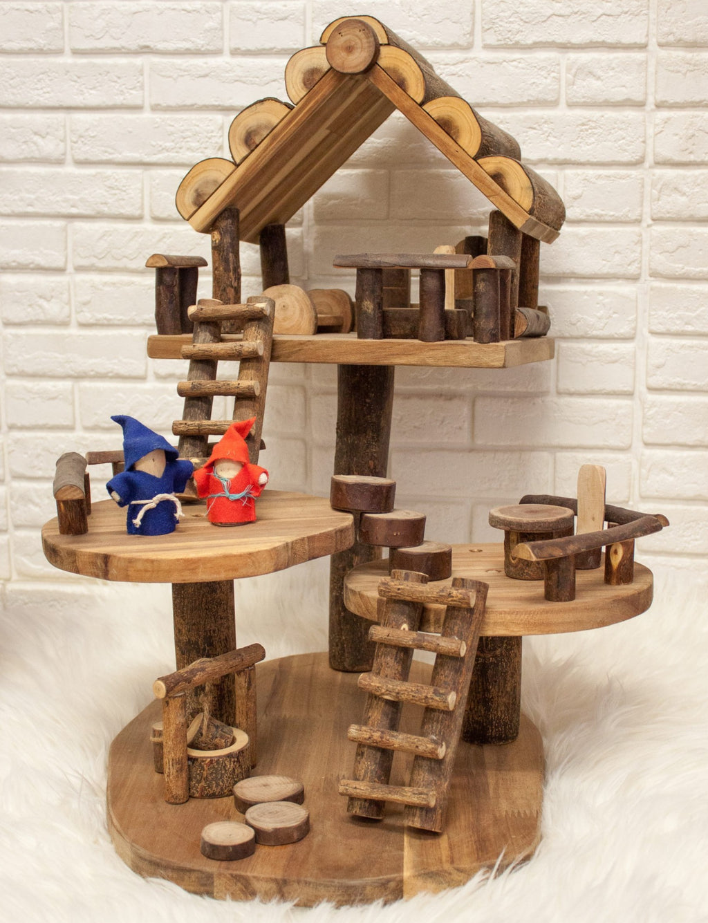 This wooden doll's house is made from recycled branches of rubber and acacia timber and is a great natural toy gift idea for kids 3 years and older. 