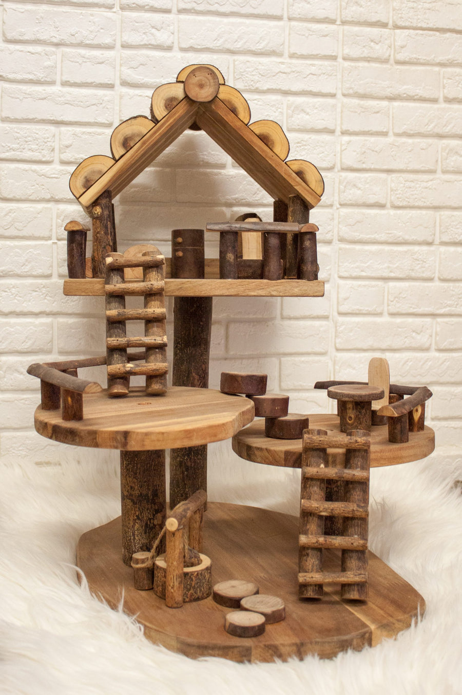 This wooden doll's house is made from recycled branches of rubber and acacia timber and is a great natural toy gift idea for kids 3 years and older. 