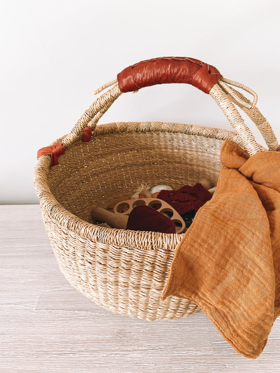 Woven basket with leather handle home decor
