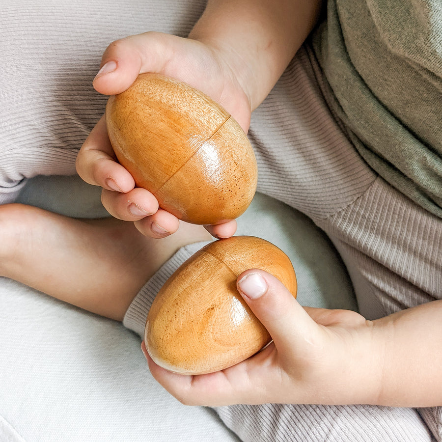 This large wooden egg filled with beads is a wonderful musical toy for open-ended and sensory play.