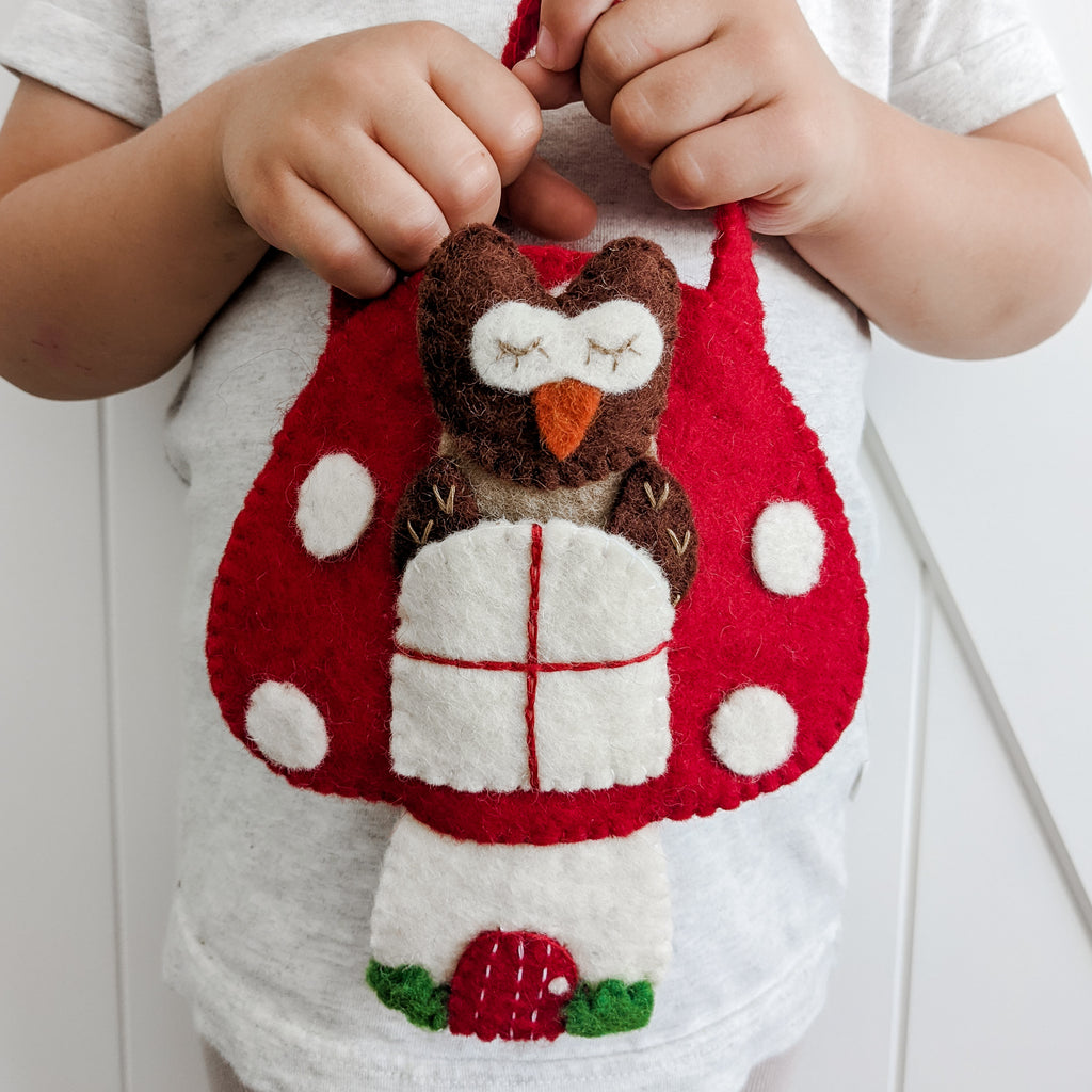Woodland felt play set which includes  a felt bear, felt racoon, owl and fox. 