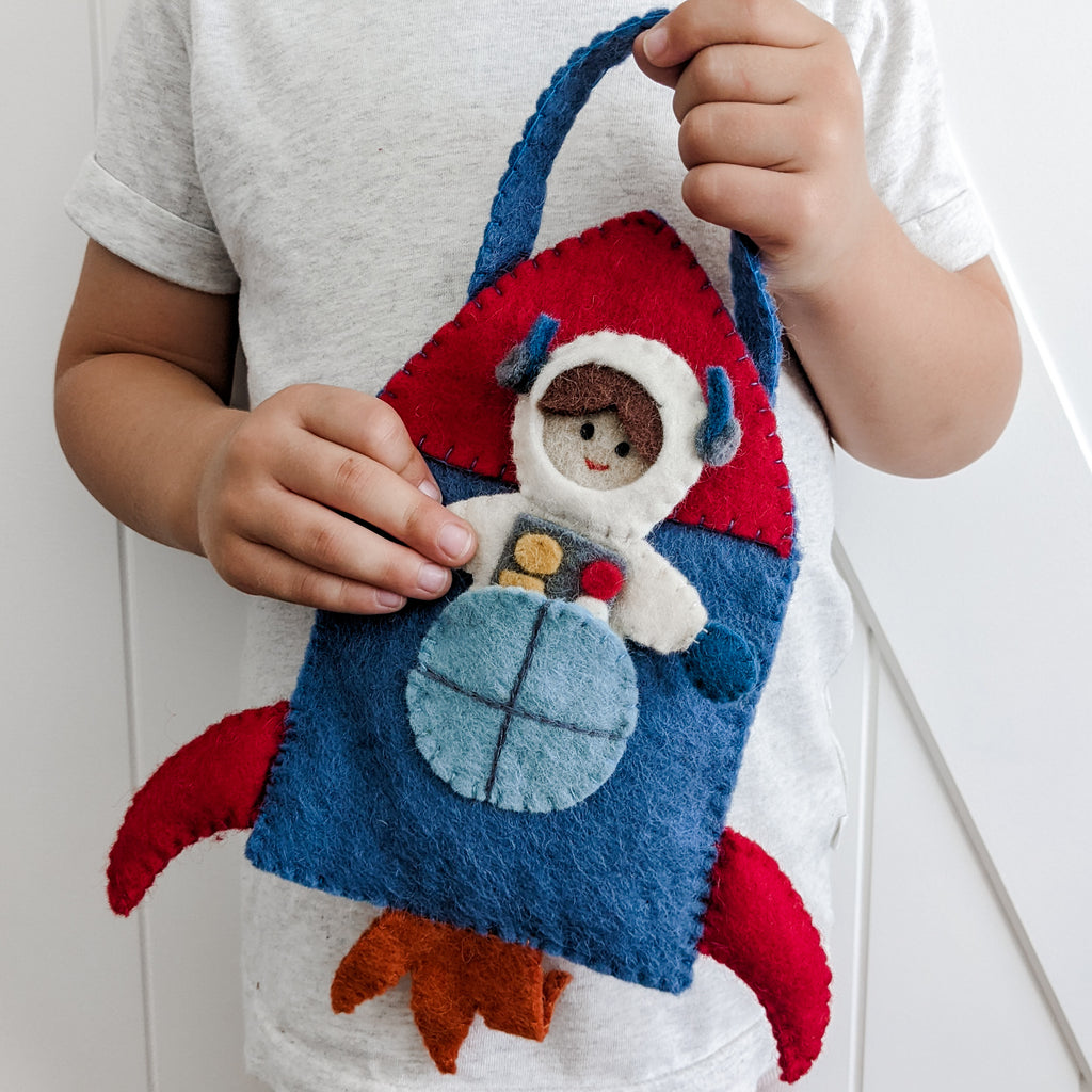 Outer space felt play set which includes an astronaut, alien, star and earth