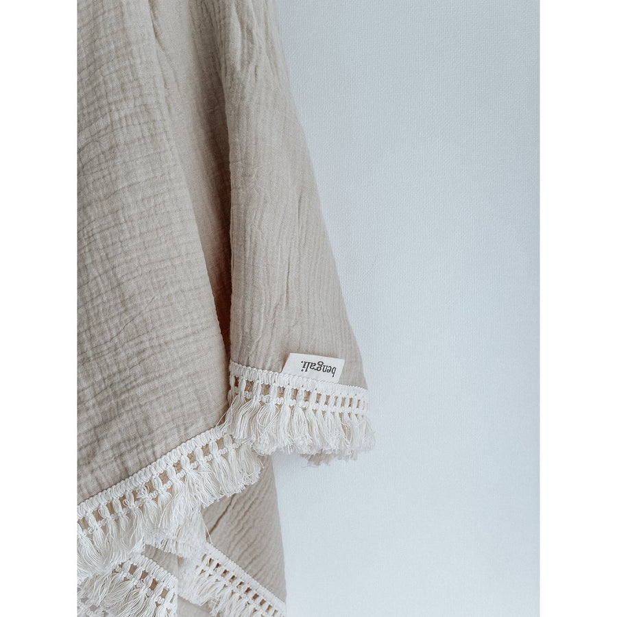 Cotton Muslin Fringe Swaddle in Oatmeal. Ethically-made, eco-friendly children's accessories NZ. 