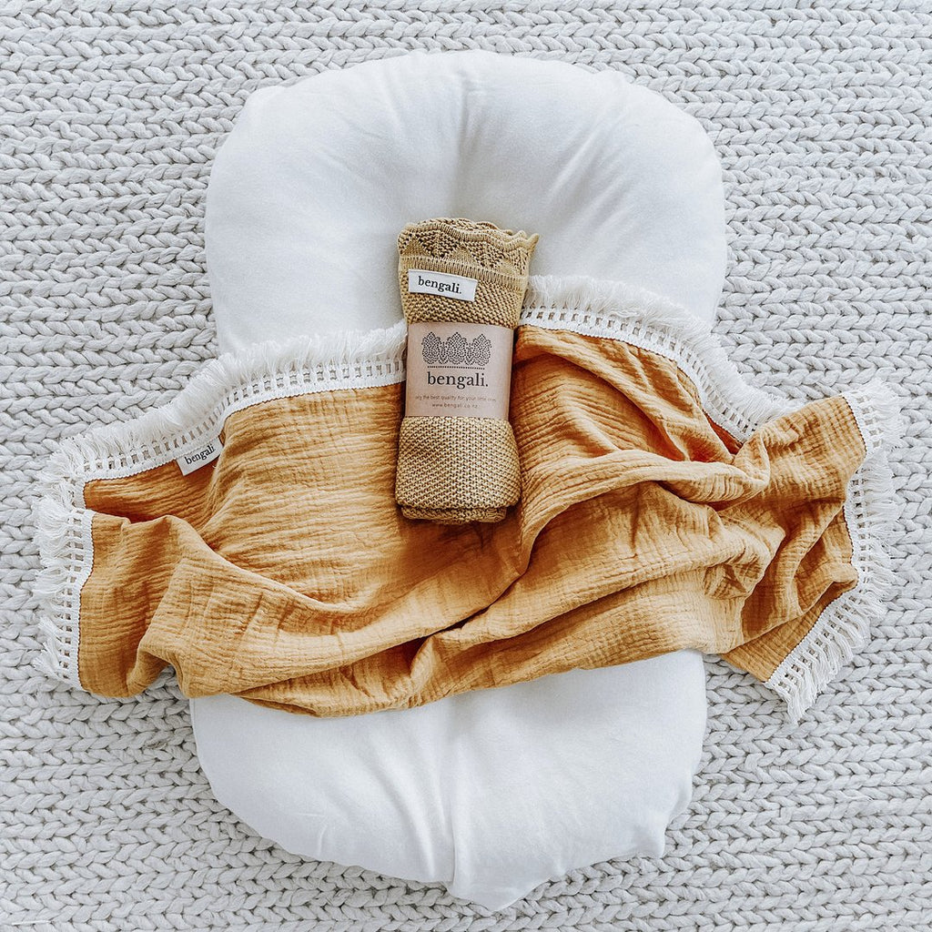 Cotton Muslin Fringe Swaddle in Tuscan Sun. Ethically-made, eco-friendly children's accessories NZ. 