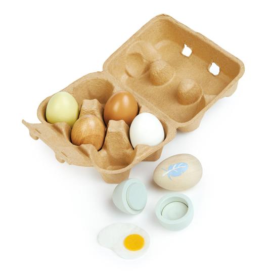 These solid wood eggs are beautifully painted and come in an authentic egg carton. Includes 6 wooden eggs and one felt egg toy - a super sweet addition to any play kitchen.