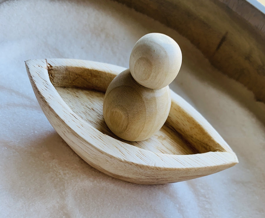 Mini wooden canoe toy. Ethically made and sustainable children's toy.