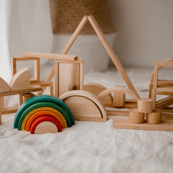 Wooden toy blocks with a wooden rainbow. Made with child-safe and non-toxic materials. 