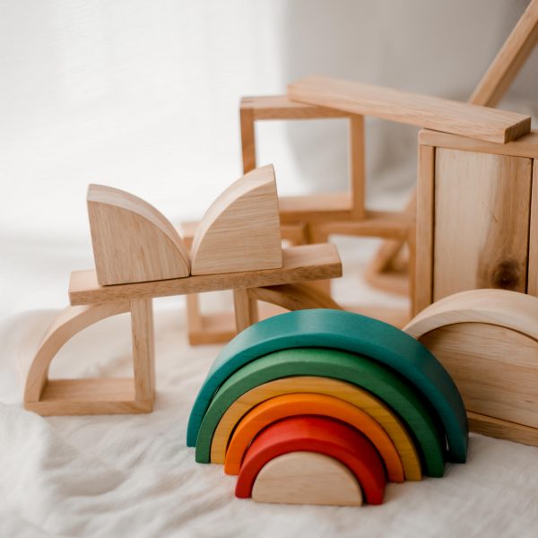 Wooden toy blocks with a wooden rainbow. Made with child-safe and non-toxic materials. 