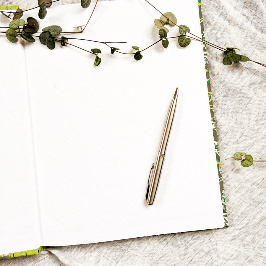 Eco-friendly journal with 100% tree-free, cotton paper. Green with floral motifs. 