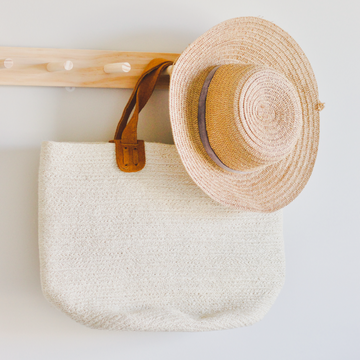 This beautiful cream bucket tote is made from jute and has two brown suede handles. Designed in New Zealand and ethically made in Bangladesh.