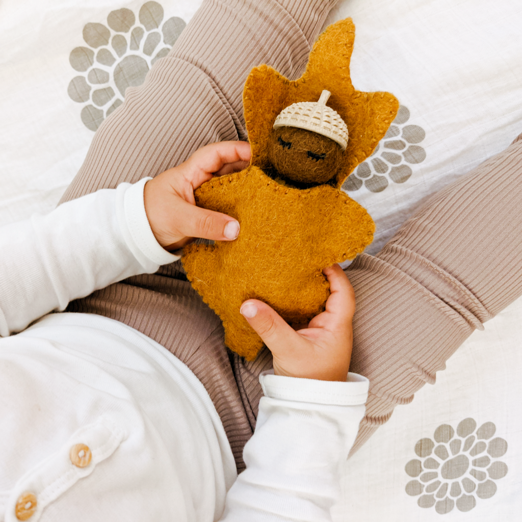 Acorn baby toy made from felted wool. 