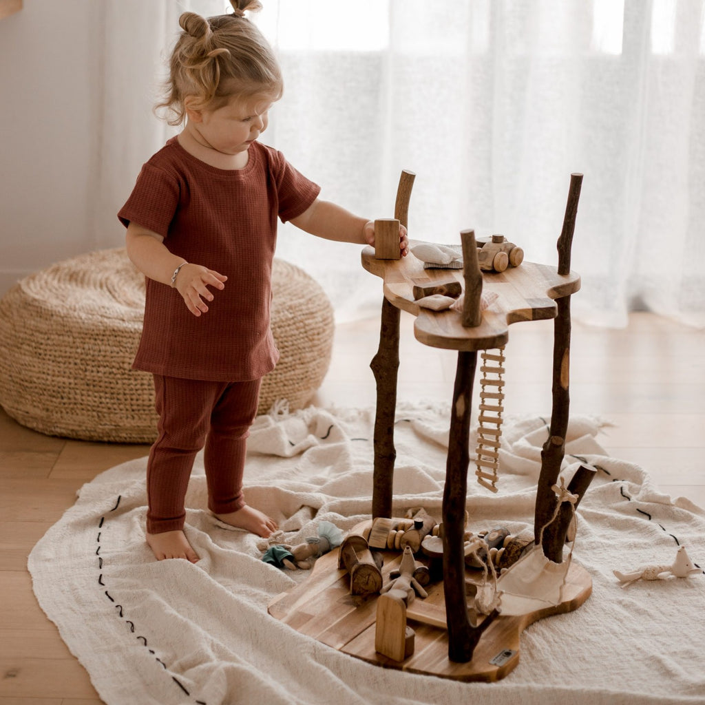 This nature-inspired children's jungle treehouse is made from recycled branches of rubber and acacia timber and is large enough for several children to use at once.