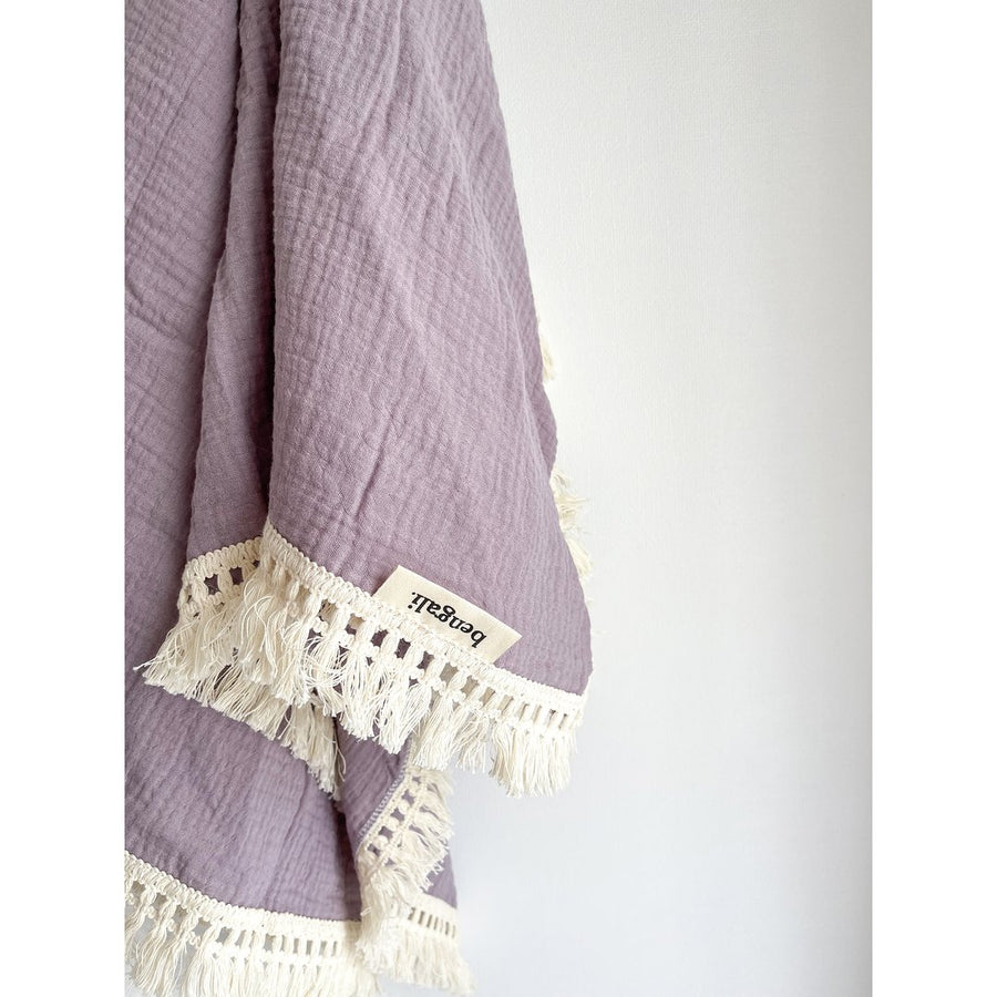 Cotton Muslin Fringe Swaddle in Lavender. Ethically-made, eco-friendly children's accessories NZ. 